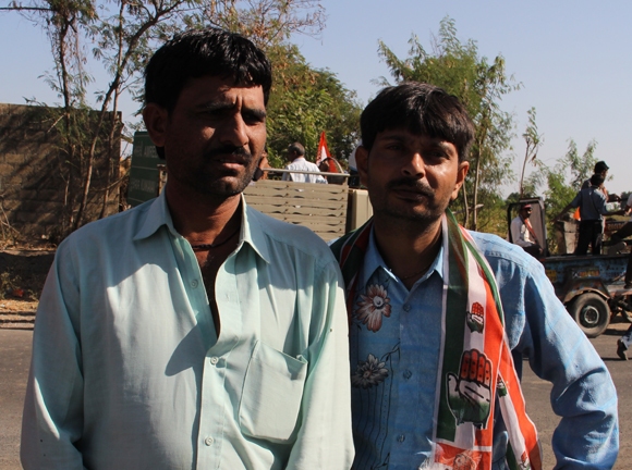 Mukesh Chotangia (left), a tailor from Aneeda village