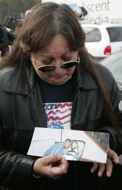 A woman cries for her brother who was killed in the 2005 Red Lake High School massacre in Minnesota.