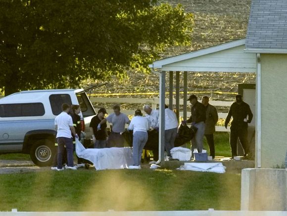 The body of the gunman is carried from a schoolhouse in Nickel Mines, Pennsylvania, October 2, 2006