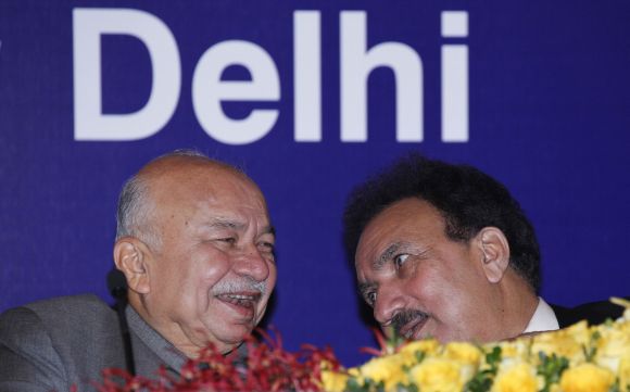 Home Minister Sushilkumar Shinde speaks to his Pakistani counterpart Rehman Malik during a meeting in New Delhi on Friday
