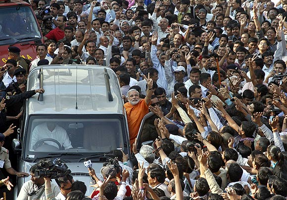 Gujarat Chief Minister Narendra Modi cheered on by his supporters