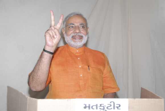 Modi casts his vote during the second phase of Gujarat elections in Ahmedabad