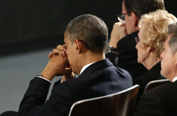Barack Obama attends a vigil in Newtown, Connecticut for Sandy Hook Elementary School's shooting victims