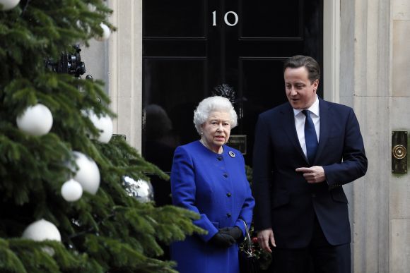 Britain's Queen Elizabeth is greeted by Prime Minister David Cameron as she arrives at Number 10 Downing Street in London