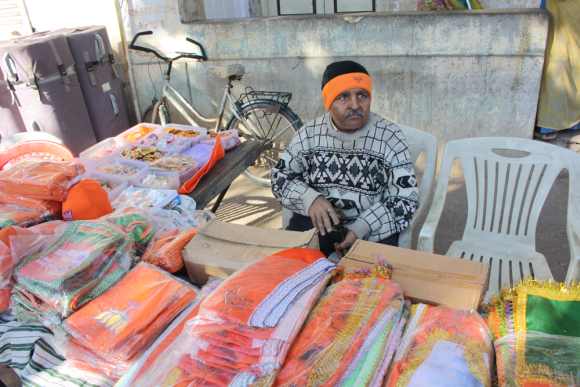A vendor sells BJP flags and tee-shirts in Khanpur