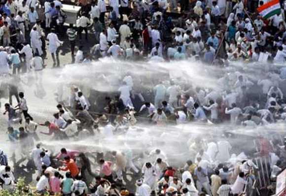 Police use water cannons to dispese protestors