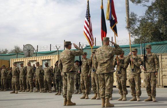 US troops with the NATO led-International Security Assistance Force attend a security transition from NATO troops to Afghan forces in Nangarhar, Afghanistan