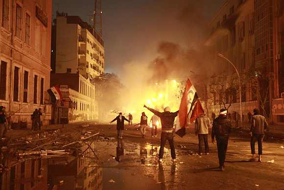 Protesters chant anti-government slogans during a protest condemning the death of soccer fans at Port Said stadium