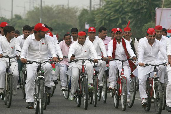 Mulayam Singh's son Akhilesh, centre, on a bicycle yatra with supporters