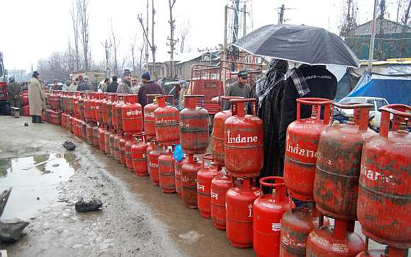 People wait for cylinders as rains lash parts of the Valley