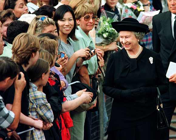 Queen Elizabeth II meets members of the public waiting in a queue to sign the book of condolence for Diana, Princess of Wales, outside St James's Palace, September 5 on 1997