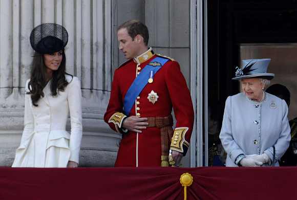 Britain's Queen Elizabeth, Prince William and his wife Catherine, Duchess of Cambridge  walk onto the balcony of Buckingham Palace after attending the Trooping the Colour ceremony in central London June 11, 2011. Trooping the Colour is a ceremony to honour the sovereign's official birthday