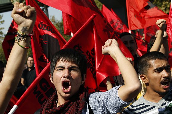 Protesters shout slogans as they march during a protest against Turkey's government in Ankara