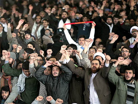 Protestors shout slogans during Friday prayers at Tehran