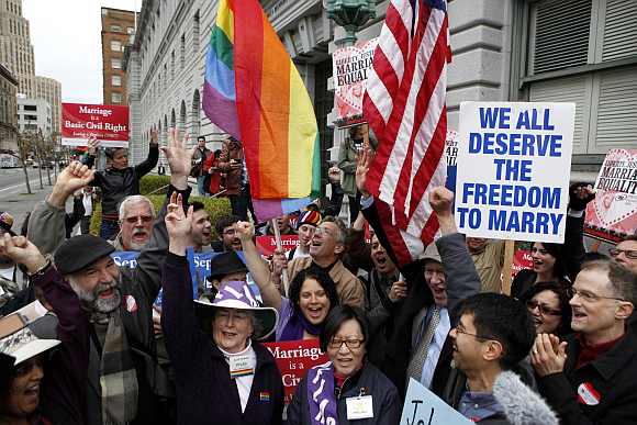 Gay Marriage advocates cheer during a rally moments before hearing the news of the Proposition 8 over-ruling outside the Ninth Circuit Courthouse in San Francisco, California