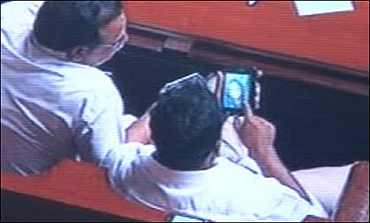 A file photo of MLAs watching porn in the Karnataka Assembly