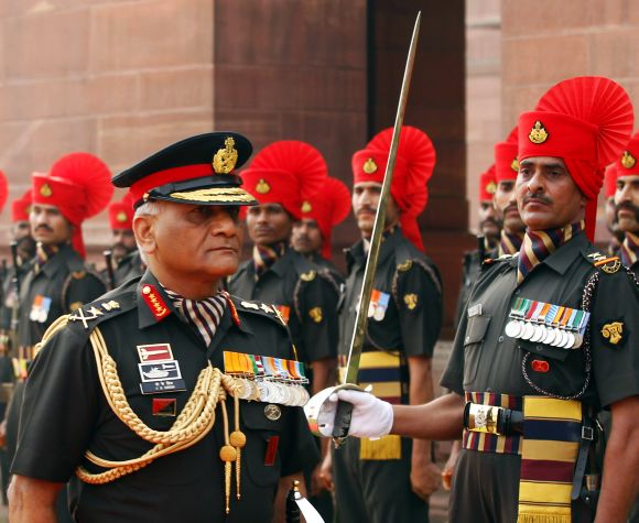 Then army chief General V K Singh inspects a guard of honour in New Delhi.