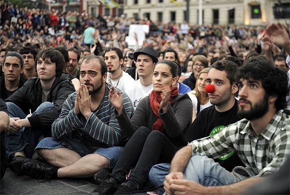 Crowds listen to speeches during a protest in the Plaza Arriaga in Bilbao, Spain