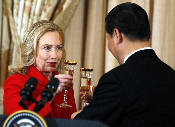 US Secretary of State Hillary Clinton toasts to China's Vice President Xi Jinping at a luncheon at the State Department in Washington, February 14