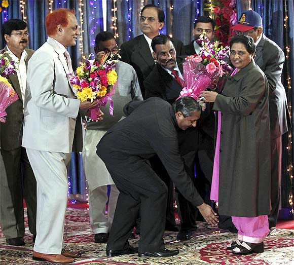 A BSP member takes blessings of Mayawati