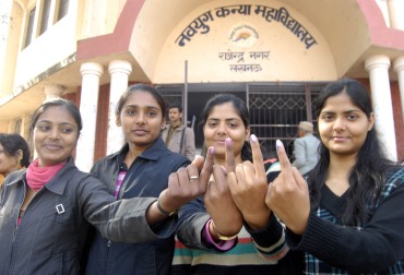 Voters outside a polling booth in Lucknow