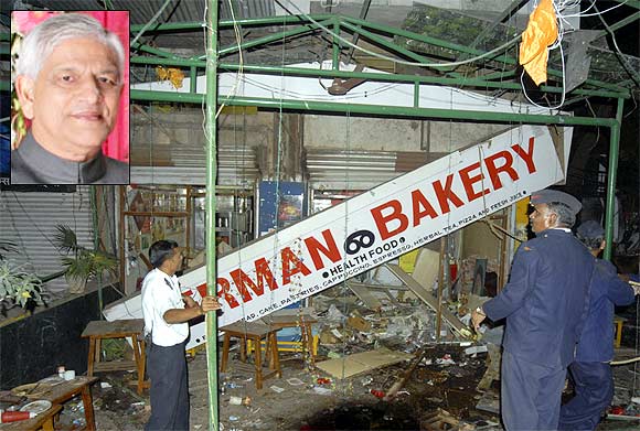 Firefighters examine the site of a bomb blast at the German Bakery restaurant in Pune in February, 2010. (Inset) C D Sahay