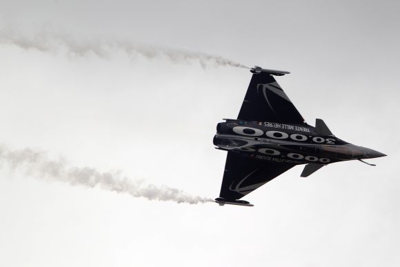 A Dassault Rafale fighter jet takes part in a flying display during an air show in Paris