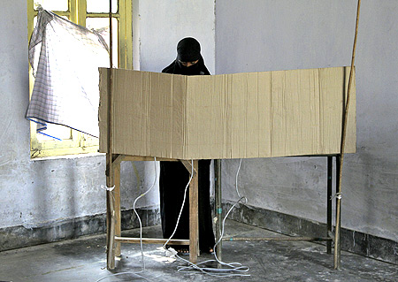 A woman casts her vote in Azamgarh, UP.