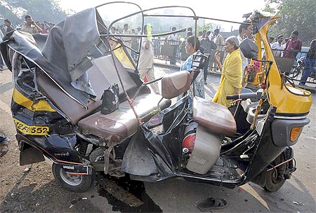 A damaged autorickshaw in Pune where a government bus driver sped through the streets smashing his empty bus into dozens of vehicles killing 8 and injuring 30