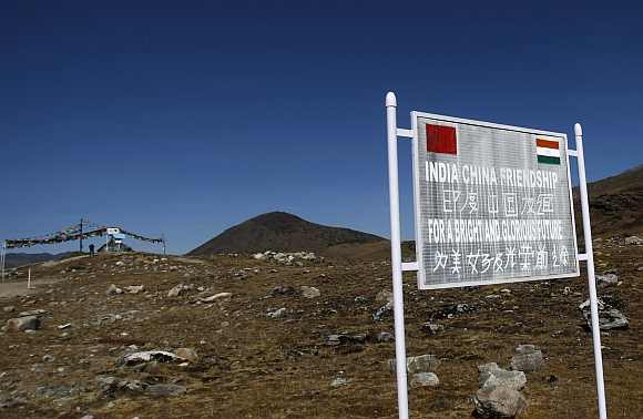 A signboard is seen from the Indian side of the Indo-China border at Bumla, Arunachal Pradesh