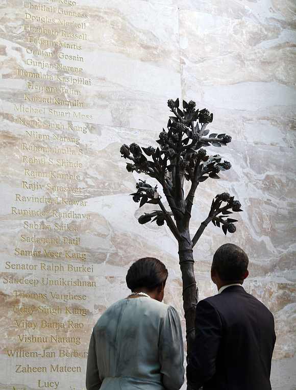 US President Barack Obama and first lady Michelle Obama view the 26/11 memorial at the Taj Mahal Palace and Tower Hotel