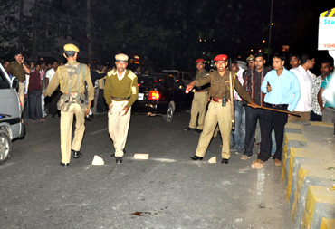 Security personnel inspect the blast site at Ganeshguri area in Guwahati