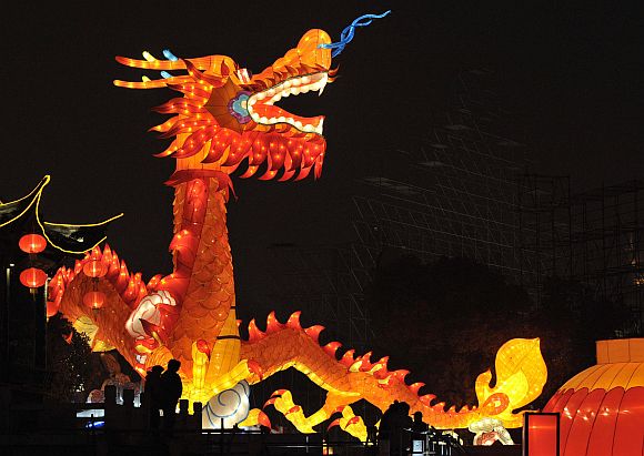 A dragon-shaped lantern is lit up at a temple fair in Nanjing, Jiangsu province, in China