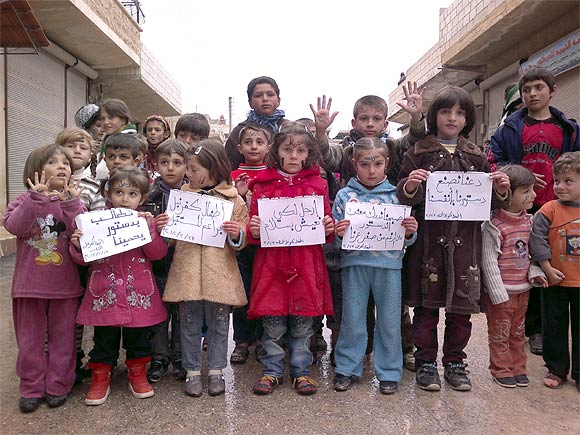 Children take part in a protest against Syria's President Bashar al-Assad in Kafranbel, near Idlib