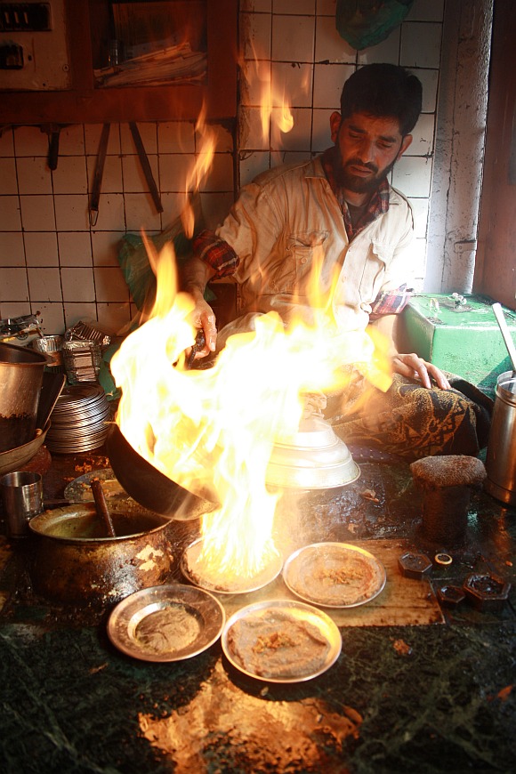 A local cook preparing harisa