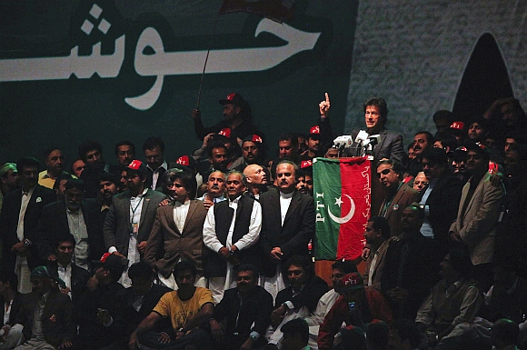 Imran Khan gestures while delivering a speech to lead the Pakistan Tehreek-e- Insaf rally on December 25, 2011 in Karachi.
