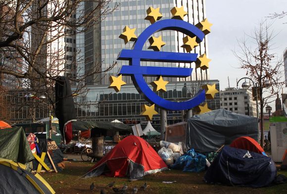 Tents of 'Occupy Frankfurt' movement are pictured next to Euro currency sign sculpture in front of ECB headquarters in Frankfurt, Germany