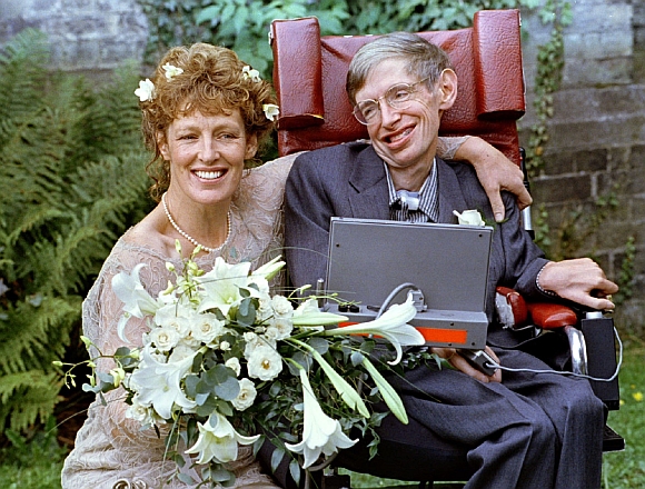 Stephen Hawking and his wife Elaine Mason pose for pictures after the blessing of their wedding on September 16, 1995