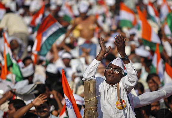 A supporter of Anna Hazare gestures at the venue of his three-day fast at the Bandra-Kurla Complex grounds in Mumbai