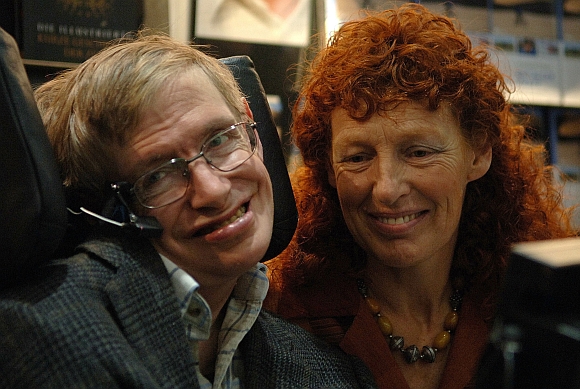 British astrophysicist Professor Stephen Hawking and his wife Elaine visit the stand of German bookseller Rowohlt at the Frankfurt book fair
