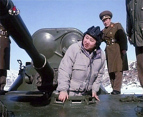 New leader of North Korea Kim Jong-un inspects an armoured vehicle in this undated still image taken from video