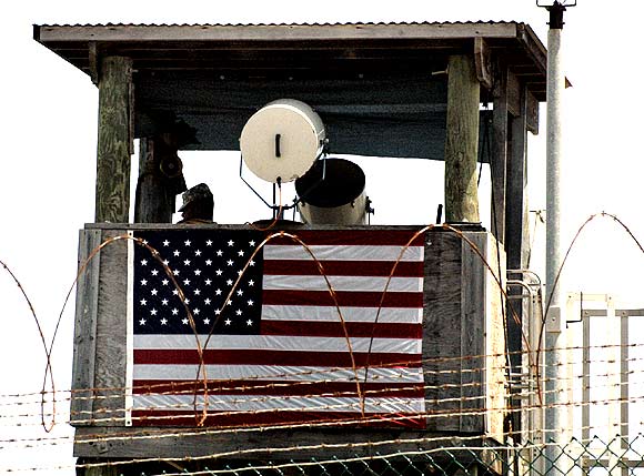A guard looks from a tower above the Camp 4 detention facility for terrorism suspects at the US naval base at Guantanamo Bay