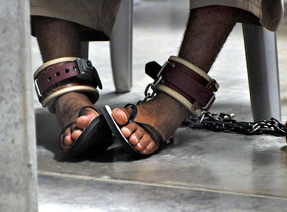 A Guantanamo detainee's feet are shackled to the floor as he attends a Life Skills class inside the Camp 6 high-security detention facility at the US naval base