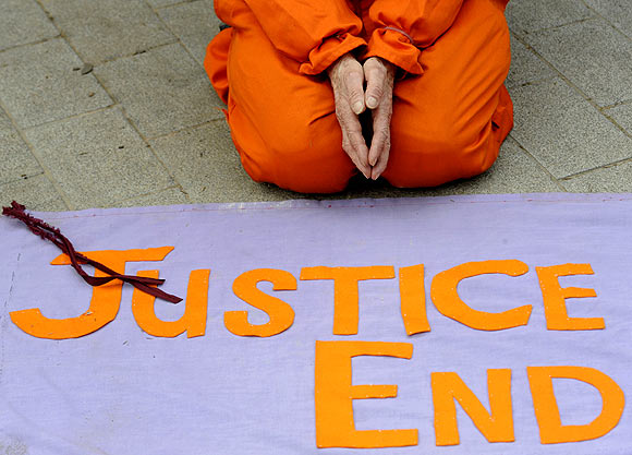 A demonstrator protests outside the US embassy in London for the release from the US prison in Guantanamo Bay in Cuba, of British detainee Binyam Mohamed