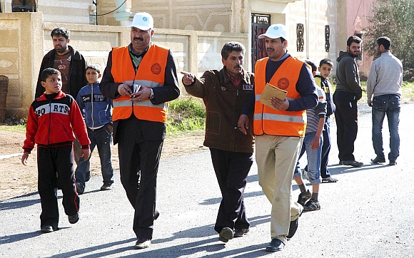 Members from Arab League observers delegation visit al-Msefra town near Deraa, southern Syria
