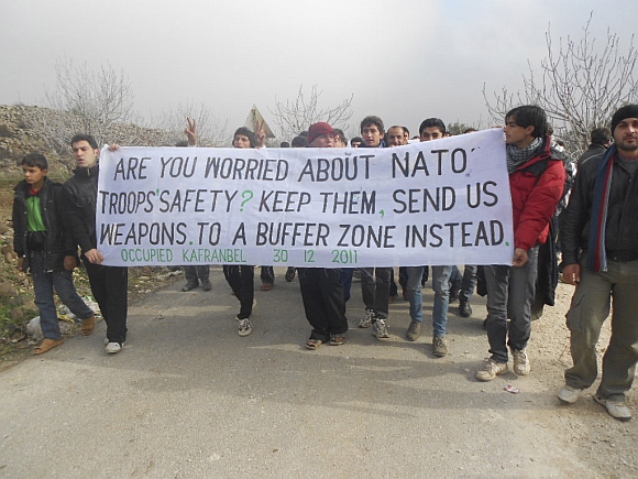 Demonstrators protest against Syria's President Bashar al-Assad in Kafranbel, near Adlb