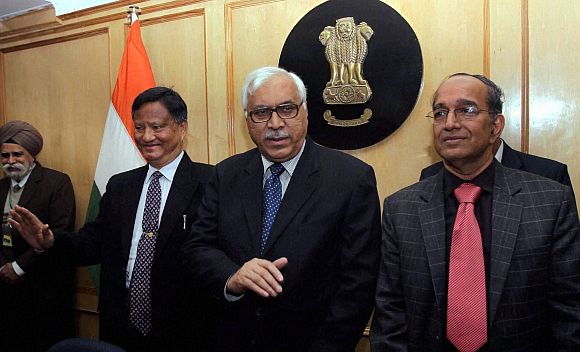 CEC S Y Quraishi flanked by Election Commissioners V S Sampath (R) and H S Brahma