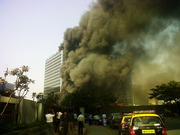 Smoke billows out of The Capital Tower in Mumbai's BKC after its first and second floors were engulfed in fire