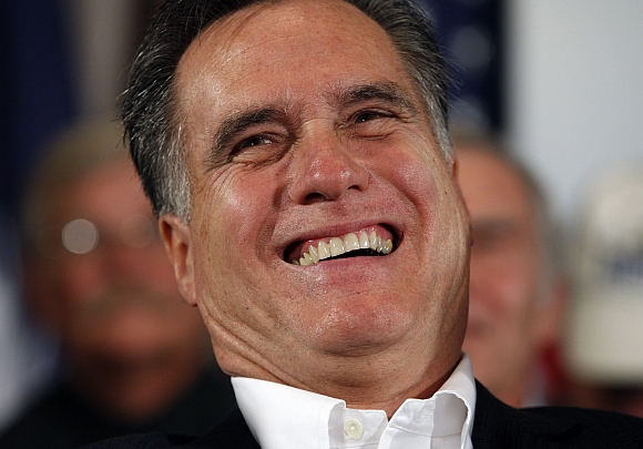 US Republican presidential candidate and former Massachusetts governor Mitt Romney laughs during an event with war veterans in Hilton Head, South Carolina