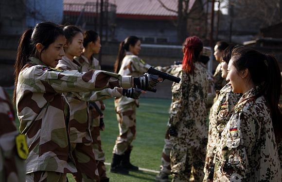 In PHOTOS: China's female bodyguards - Rediff.com News